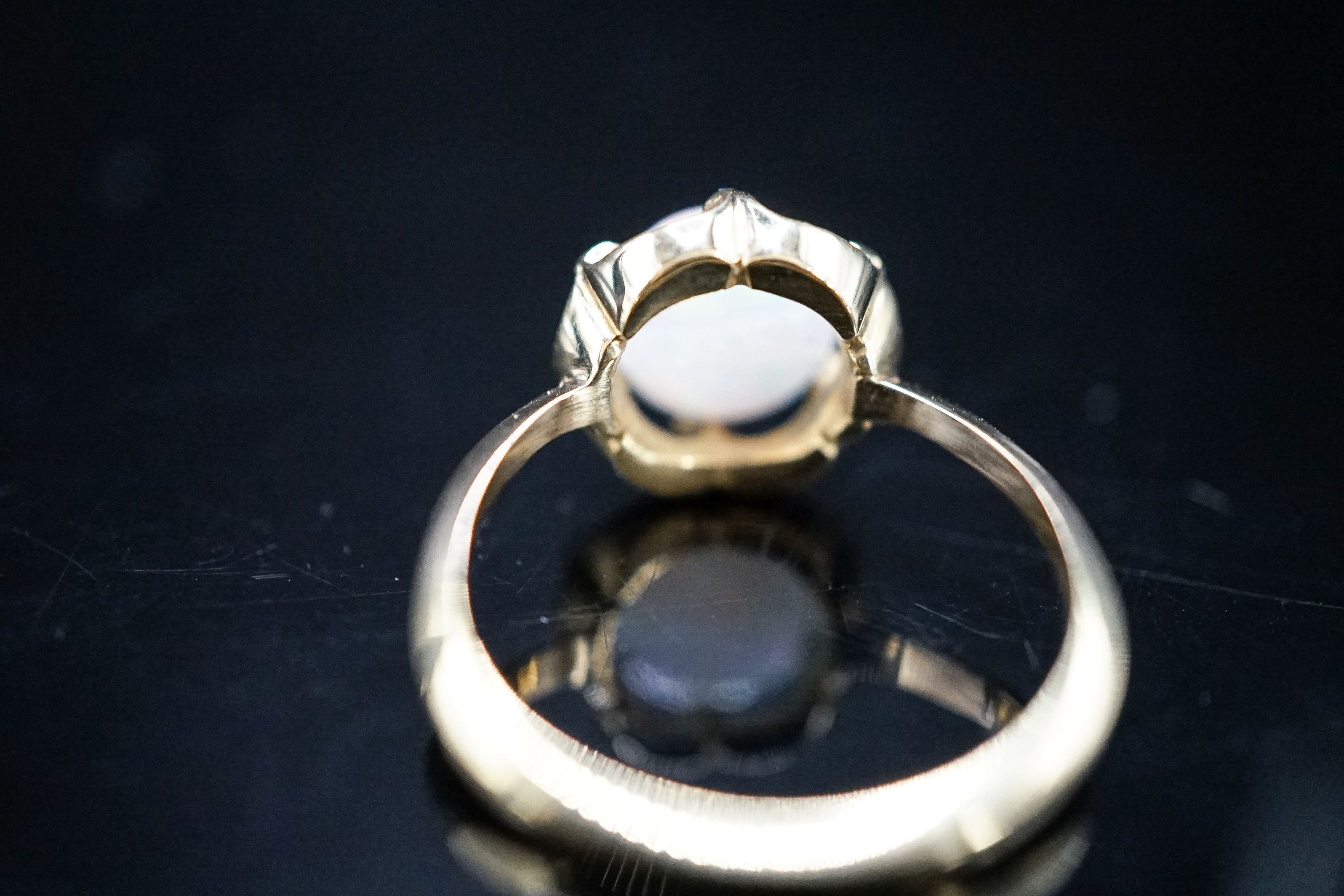 An 18ct, blue enamel, diamond chip and opal set dress ring, size R, gross weight 4.3 grams.